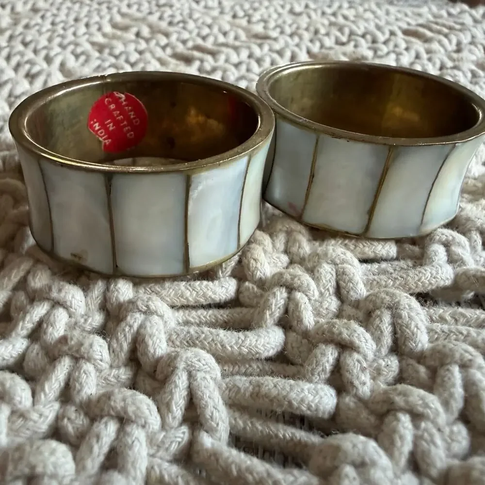 Two brass and (abalone) mother of pearl napkin rings